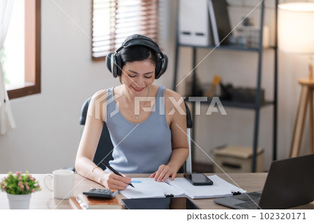 Beautiful Asian young woman wear casual working with social media.Freelance woman working online sale marketing. Shopping online at home. Beautiful Asian young woman wear casual working with social media.Freelance woman working online sale marketing. Shopping online at home. 102320171