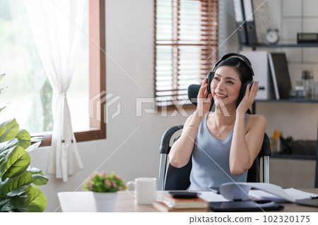 Beautiful Asian young woman wear casual working with social media.Freelance woman working online sale marketing. Shopping online at home. Beautiful Asian young woman wear casual working with social media.Freelance woman working online sale marketing. Shopping online at home. 102320175