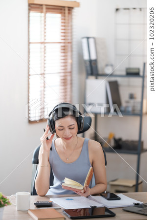 Beautiful Asian young woman wear casual working with social media.Freelance woman working online sale marketing. Shopping online at home. 102320206