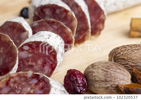 Chunks of sliced sausage with white mold Chunks of sliced sausage with white mold 102320537