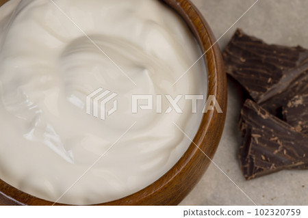 Creamy yogurt with chocolate close up 102320759