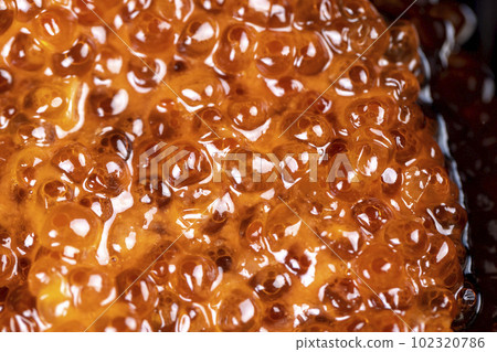Natural red salmon caviar in large quantities 102320786