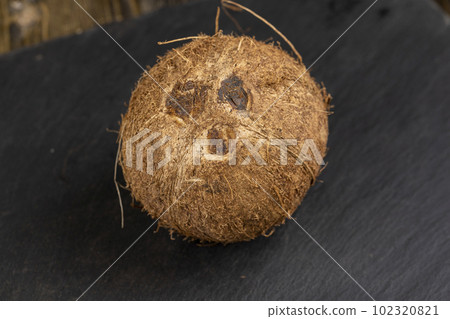 a close-up of a brown coconut shell, close-up a close-up of a brown coconut shell, close-up 102320821