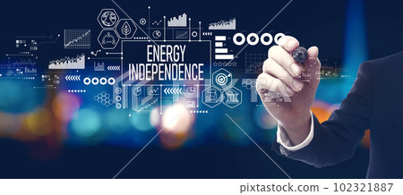 Energy Independence concept with businessman at night Energy Independence concept with businessman at night 102321887