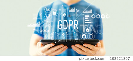 GDPR theme with man using a tablet GDPR theme with man using a tablet 102321897