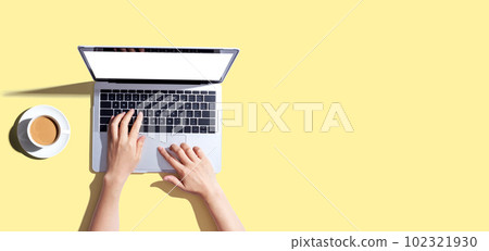 Person using a laptop computer 102321930