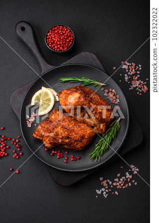 Delicious fried sea bass fish in the form of slices with spices and herbs 102322022