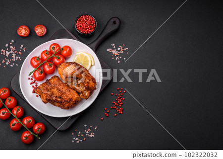 Delicious fried sea bass fish in the form of slices with spices and herbs 102322032