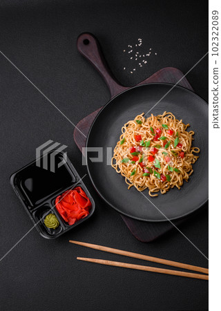 Delicious fresh Asian noodles with vegetables, salt, spices and herbs Delicious fresh Asian noodles with vegetables, salt, spices and herbs 102322089