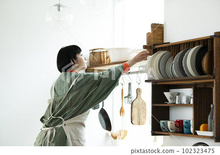 Female cooking image back view 102323475