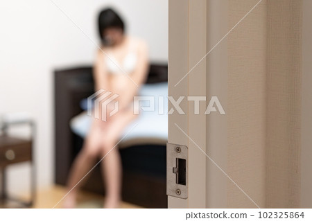 A woman in underwear sitting on a bed "shooting out of focus" A woman in underwear sitting on a bed "shooting out of focus" 102325864