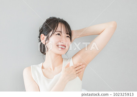 Smiling Asian woman with depilation and deodorant image Smiling Asian woman with depilation and deodorant image 102325913