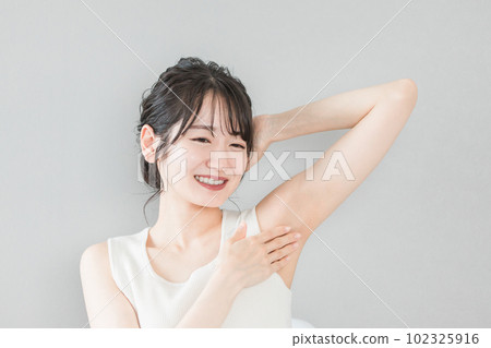 Smiling Asian woman with depilation and deodorant image Smiling Asian woman with depilation and deodorant image 102325916