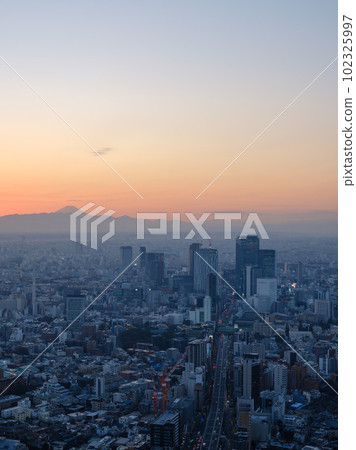 Tokyo _ Mt.Fuji seen over Shibuya and a superb view of the sunset Tokyo _ Mt.Fuji seen over Shibuya and a superb view of the sunset 102325997