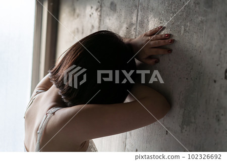 A woman who is worried about her underwear A woman who is worried about her underwear 102326692