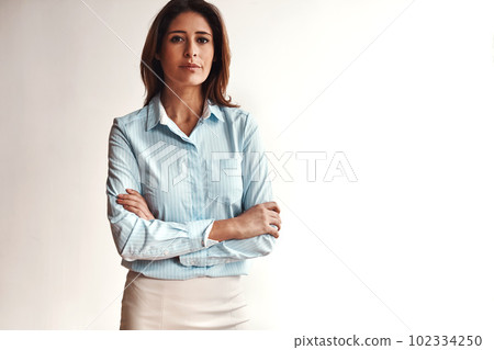 Invest in yourself and go further. Portrait of a confident businesswoman in a modern office. Invest in yourself and go further. Portrait of a confident businesswoman in a modern office. 102334250