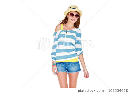 Carefree summer fashion. Studio shot of a young woman dressed for summer isolated on white. 102334658