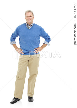 Unashamed of who he is. Studio portrait of a mature, attractive male standing casually with his hands on his hips. Unashamed of who he is. Studio portrait of a mature, attractive male standing casually with his hands on his hips. 102334758