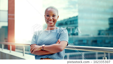 Black woman in city for business portrait while happy and arms crossed outdoor with vision and pride. Face of entrepreneur person with urban buildings and motivation for career goals as future leader Black woman in city for business portrait while happy and arms crossed outdoor with vision and pride. Face of entrepreneur person with urban buildings and motivation for career goals as future leader 102335307