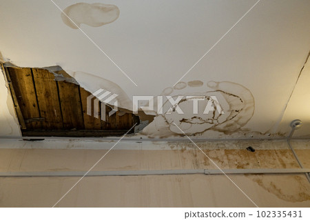 Flooding rainwater, causing damage, peeling paint and mildew. Flooding rainwater, causing damage, peeling paint and mildew. 102335431