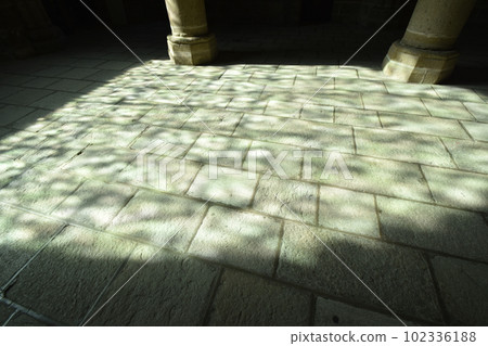 Beautiful stained glass shadows reflected by the light that penetrates the floor inside Mont Saint-Michel Abbey Beautiful stained glass shadows reflected by the light that penetrates the floor inside Mont Saint-Michel Abbey 102336188