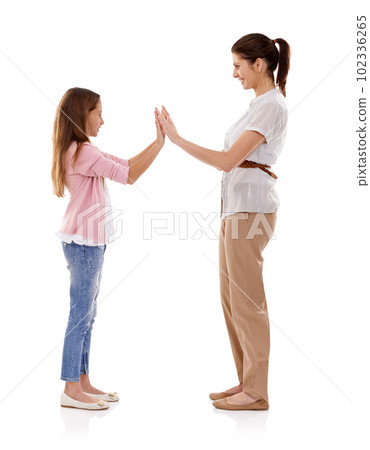 Fun and games with Mom. Side view of a mother and daughter being playful. 102336265