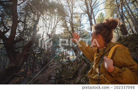 caucasian woman enjoys being in nature, 102337098