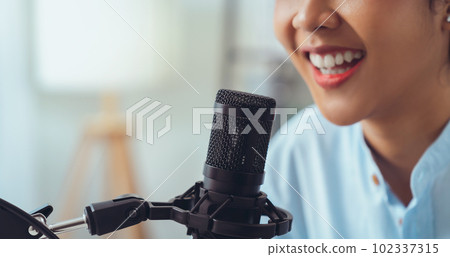 Woman use microphones wear headphones with laptop record podcast. Content creator concept. Woman use microphones wear headphones with laptop record podcast. Content creator concept. 102337315
