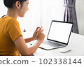 Woman hand working on laptop with blank copy space screen, mock-up for the application. 102338144