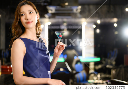 A woman waiting at the bar counter 102339775