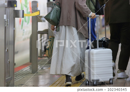 Passengers walking on the Shinkansen platform Tourists Passengers walking on the Shinkansen platform Tourists 102340345