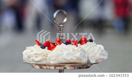 Pavlova desserts at the confectionery stand at the farmers market in Prague. 102341553