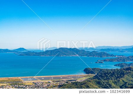 [Setonaikai National Park] The ruins of salt fields, the islands of the Seto Inland Sea and Shikoku 1 seen from the summit of Mt. Kinkouyama Okayama City and Tamano City, Okayama Prefecture 102341699