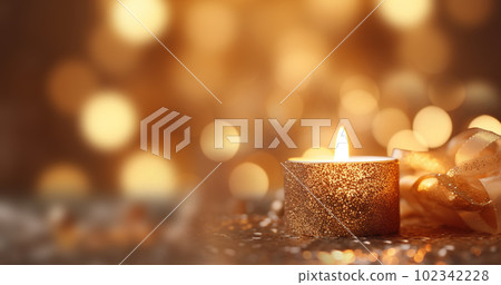 one burning candle lights at the edge of blurred festive background, decorative golden shiny candle lights copy space, Holiday,Happy New Year,Merry Christmas,Festive,party background concept 102342228