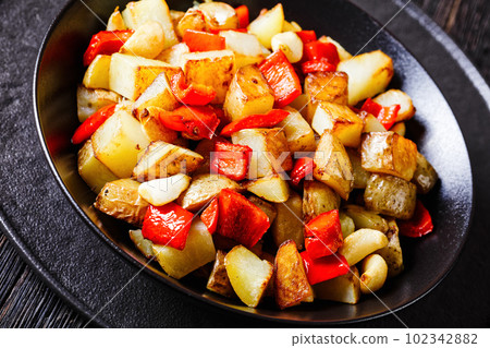 Pan-Browned Potatoes with red pepper and garlic Pan-Browned Potatoes with red pepper and garlic 102342882