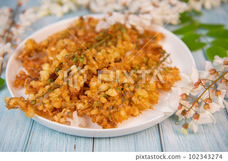 Acacia flowers fritters, Blossoming acacia with leafs, , Robinia pseudoacacia, White acacia 102343274