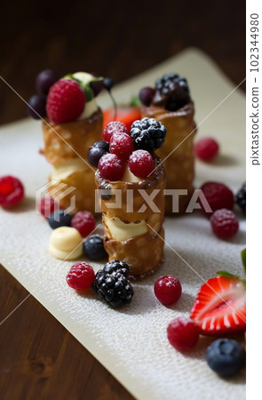 Brandy snaps with white chocolate mousse and summer berries, AI generated, AI generativ. 102344980