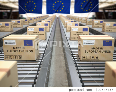 Made in European Union. Cardboard boxes with text made in European Union and EU flag on the roller conveyor. Made in European Union. Cardboard boxes with text made in European Union and EU flag on the roller conveyor. 102346737