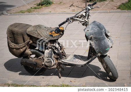 old, rusty scooter, dirty motorbike 102348415