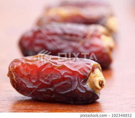 Macro of fresh Arabian Dates Macro of fresh Arabian Dates 102348852