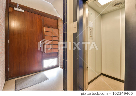 a room with a door and some shelves on either side by side in the same direction, one is open a room with a door and some shelves on either side by side in the same direction, one is open 102349460