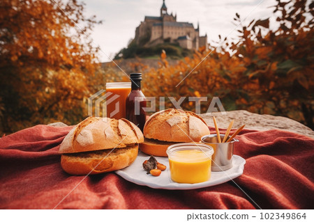 French picnic in autumn with mont saint-michel on background. Generative AI 102349864