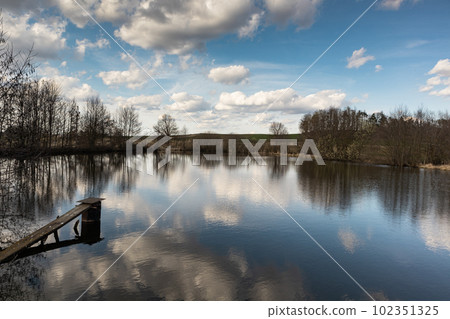 Sunny day with clouds above lake, Czech Republic 102351325