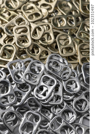 A lot of silver aluminum can pull tabs A lot of silver aluminum can pull tabs 102351497