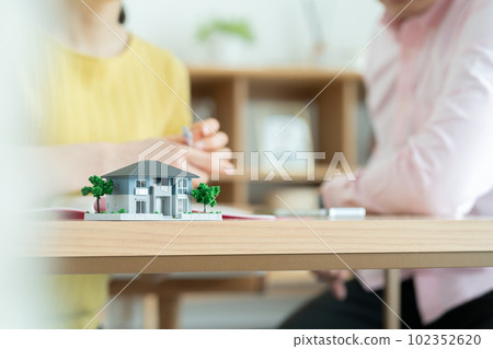 A couple planning their own home A couple considering where to live 102352620