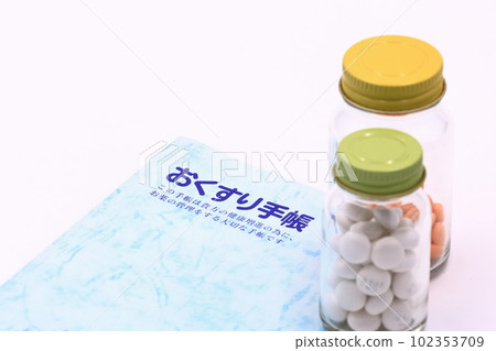 Medical image (medicine notebook and tablets) 102353709