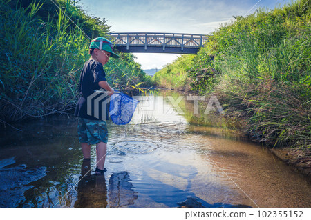 boy playing in the river boy playing in the river 102355152