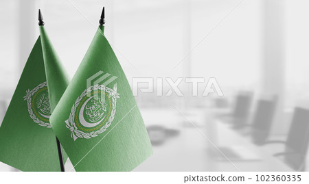 Small flags of the Arab League on an abstract blurry background 102360335