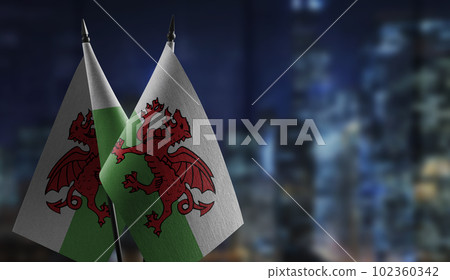 Small flags of the Wales on an abstract blurry background 102360342