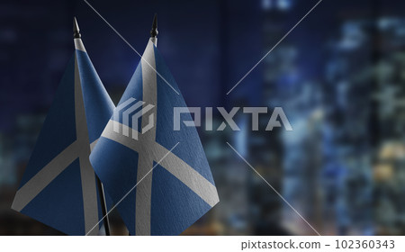 Small flags of the Scotland on an abstract blurry background Small flags of the Scotland on an abstract blurry background 102360343